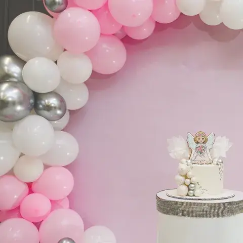 balloon-decor-styling_0001_birthday-cake-on-a-background-pink-white-and-silv-2023-11-27-05-32-04-utc
